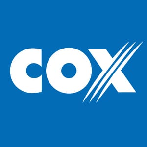 COX logo in white with stylized diagonal lines through the “X” on a solid blue background.