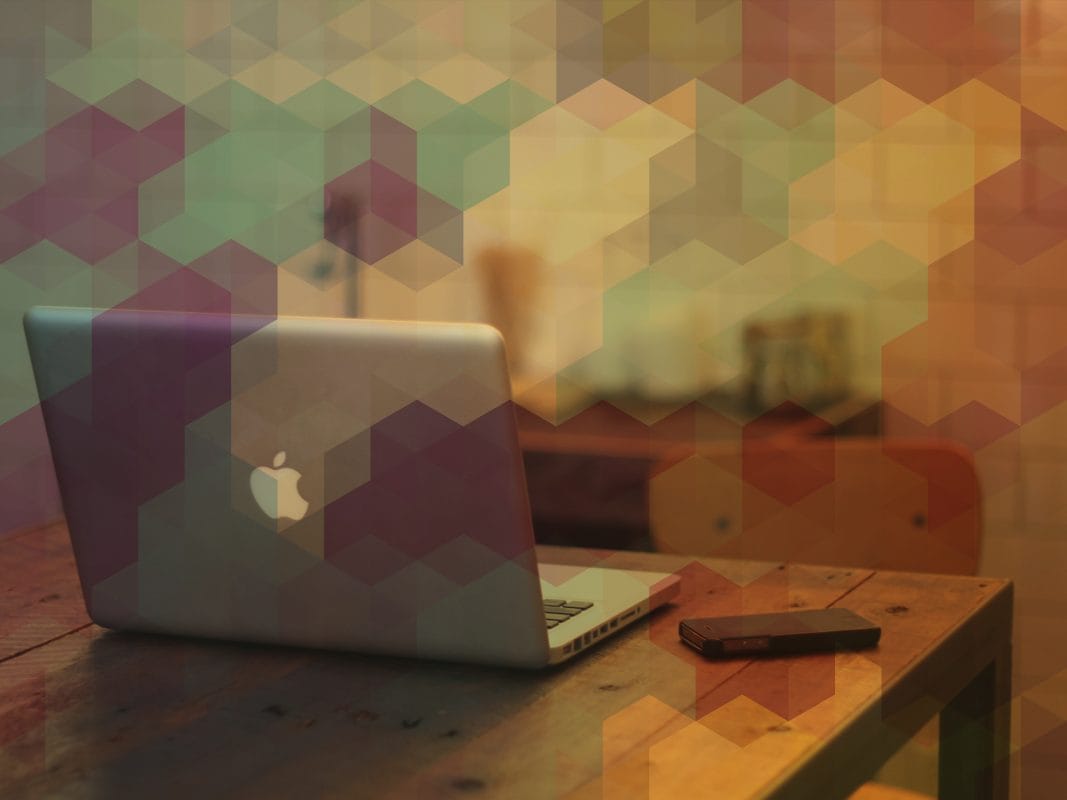 web design and branding workspace with laptop on desk, creative graphic design background with geometric overlay, logo design services