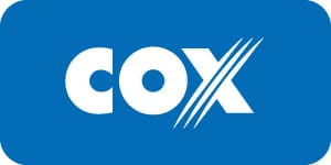 COX logo in white with stylized diagonal lines through the “X” on a small solid blue background.