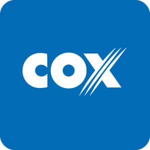 COX logo in white with stylized diagonal lines through the “X” on a large solid blue background.