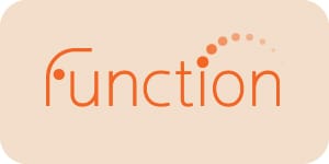 Small minimal orange Function Supplements logo featuring circular dot elements and modern typography on a neutral beige background
