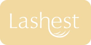 Lashest eyelash extensions logo in white on a rectangular beige background