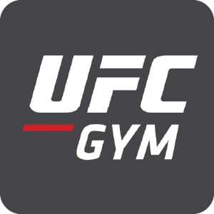 Large UFC Gym logo with bold white lettering and red underline accent on dark gray background